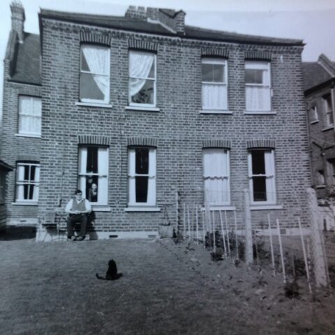 Black and white image of the back of a Warner half house in Hitcham Road