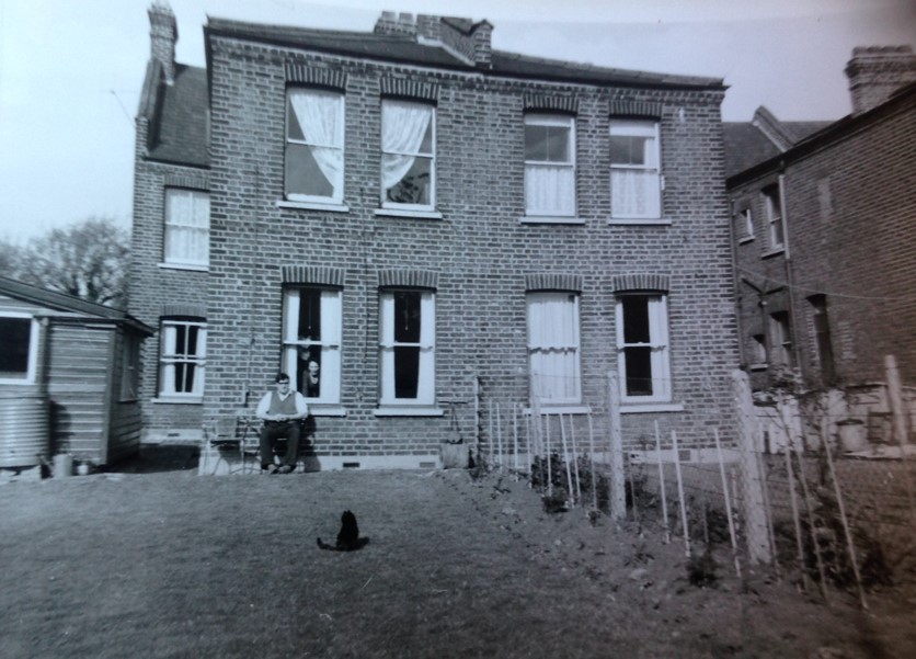 Black and white image of the back of a Warner half house in Hitcham Road