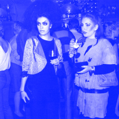 Two women wearing 80s clothing and make up, at The Lotus club in Forest Gate