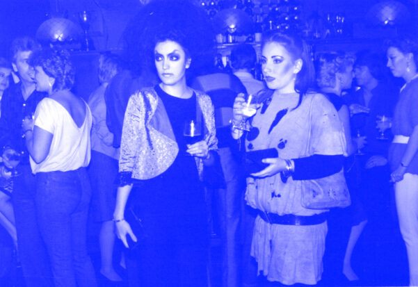 Two women wearing 80s clothing and make up, at The Lotus club in Forest Gate